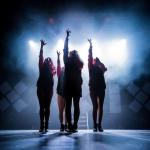 Image shows a tribute band for Little Mix performing