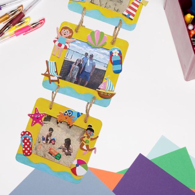 Decorated photo frames on a craft table