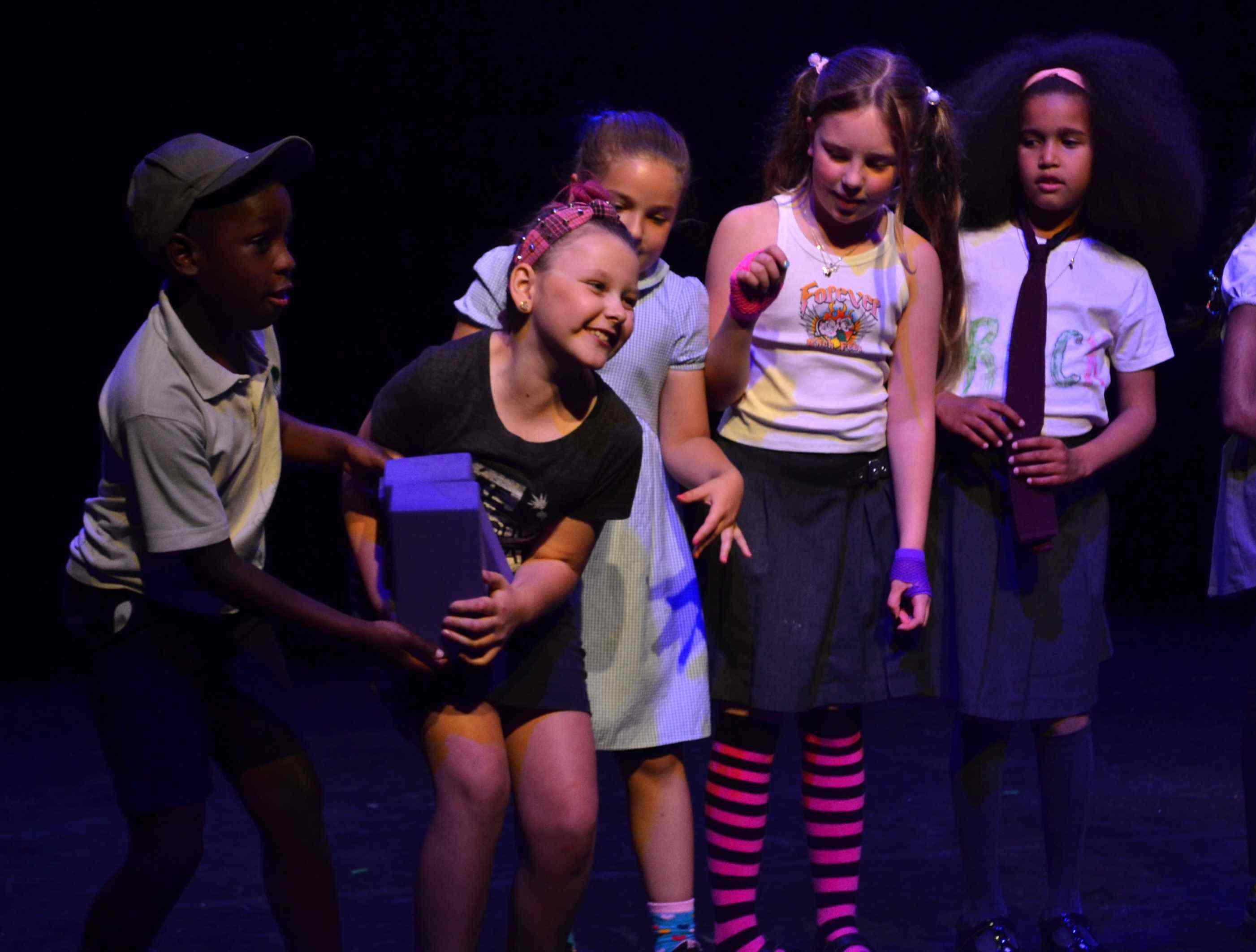 Children on stage as part of the 2024 Youth Theatre Showcase