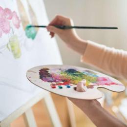 someone painting on a canvas