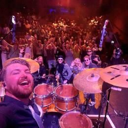 Good Times with Nile Rodgers and Chic performers with the Cornerstone crowd behind them